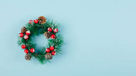 Christmas wreath. Traditional holiday decoration. Winter holidays and Christmas celebration concept. Top view, copy space, flat lay, bannerの写真素材