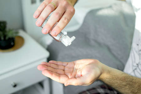 Man holds in his hands a medical hand sanitizer gel for hand. Hygiene corona virus protection....
