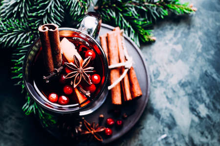 Mulled wine with cinnamon, cowberry, orange and anice. Christmas or new year drink