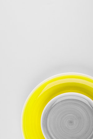 Yellow illuminating and Gray background. Flat lay, top view. Lightbox with text Color of yearの写真素材