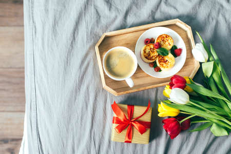 Top view on holiday breakfast on bed. Mother's day, 8 march, valentine's day concept. Delicious...