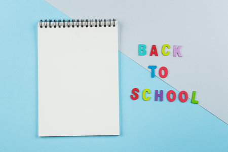 Back to school concept. School supplies in pencil case. Pink background with copy space. Flat lay, view from above.の写真素材