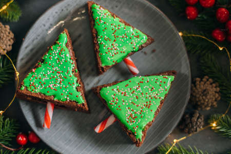 Christmas sweet tree made from chocolate brownie. Christmas fun food. Cute idea for kids for christmas dessert. Top view, crop square imageの写真素材