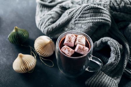 Banner image for design, web page. Glass with hot chocolate with marshmallow on dark blue background. top view.の写真素材