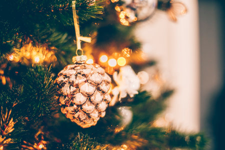 Red and sivlver decoration on Christmas tree at home interior. Holiday background with bokeh lights. copy spaceの写真素材