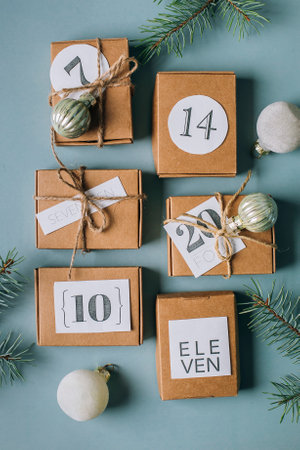 Flat lay on Christmas advent calendar. Eco Craft boxex gifts. top view.の写真素材