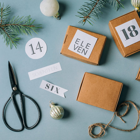 Flat lay on Christmas advent calendar. Eco Craft boxex gifts. top view.の写真素材
