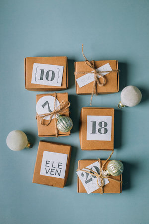 Flat lay on Christmas advent calendar. Eco Craft boxex gifts. top view.の写真素材