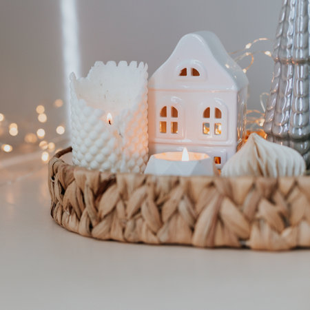 Cozy burning candles and festive decor. Winter mood. Cozy home decor. Festive decoration. Square image cropの写真素材
