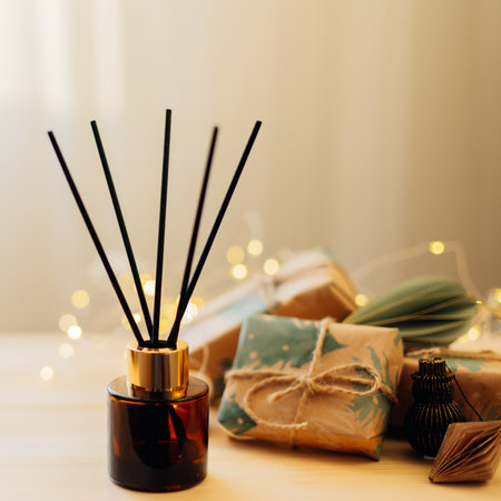 Home winter aroma fragrance diffuser on wooden table. Interior elements. Christmas and Winter decoration. Close-upの写真素材