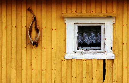 Close-up of yellow house by the see in North of Norwayの写真素材