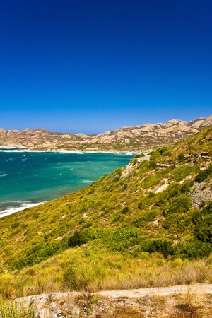 Crystal clean sea along beuty green coastline in amazing island Corsicaの写真素材