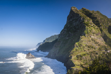 View of beautiful mountains and ocean on northern coast near Boaventura, Madeira island, Portugalの写真素材