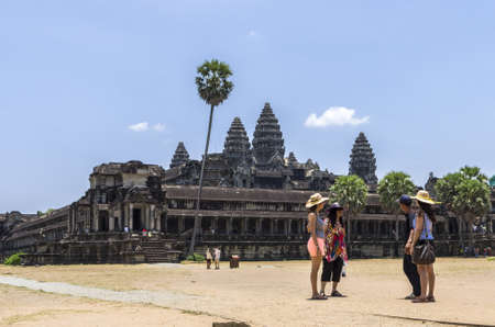 Tourists in front of the  Angkor Wat temple in Siem Reap Cambodiaのeditorial素材