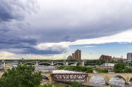 Minneapolis, Minnesota - June 17, 2013   The Stone Arch Bridge is a former railroad bridge crossing the Mississippi River at Saint Anthony Falls in downtown Minneapolis, Minnesota  The structure is now used as a pedestrian and bicycle bridge  It is an Hisのeditorial素材