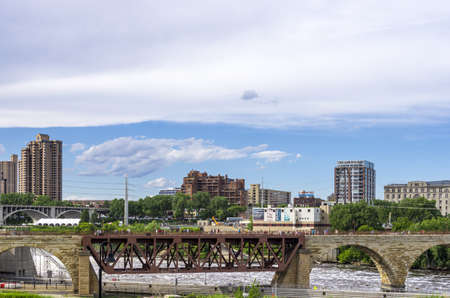 Minneapolis, Minnesota - June 17, 2013   The Stone Arch Bridge is a former railroad bridge crossing the Mississippi River at Saint Anthony Falls in downtown Minneapolis, Minnesota  The structure is now used as a pedestrian and bicycle bridge  It is an Hisのeditorial素材