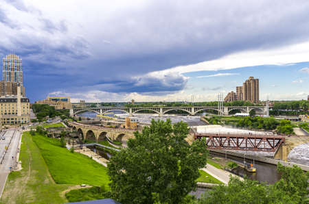 Minneapolis, Minnesota - June 17, 2013   The Stone Arch Bridge is a former railroad bridge crossing the Mississippi River at Saint Anthony Falls in downtown Minneapolis, Minnesota  The structure is now used as a pedestrian and bicycle bridge  It is an Hisのeditorial素材