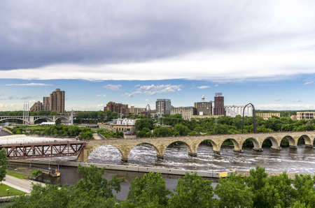 Minneapolis, Minnesota - June 17, 2013   The Stone Arch Bridge is a former railroad bridge crossing the Mississippi River at Saint Anthony Falls in downtown Minneapolis, Minnesota  The structure is now used as a pedestrian and bicycle bridge  It is an Hisのeditorial素材