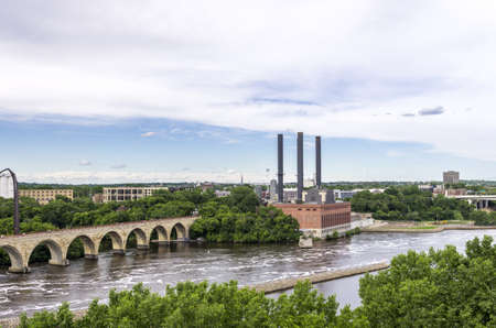 Minneapolis, Minnesota - June 17, 2013   The Stone Arch Bridge is a former railroad bridge crossing the Mississippi River at Saint Anthony Falls in downtown Minneapolis, Minnesota  The structure is now used as a pedestrian and bicycle bridge  It is an Hisのeditorial素材