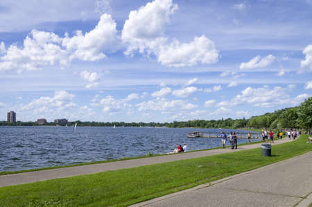 Lake Calhoun, Minneapolis - June 17, 2013   People strolling along the banks of the Lake Calhoun in Minneapolis, Minnesota のeditorial素材