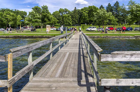 Lake Calhoun, Minneapolis - June 17, 2013   A wooden walkway jutting into the Lake Calhoun in Minneapolis, Minnesota のeditorial素材