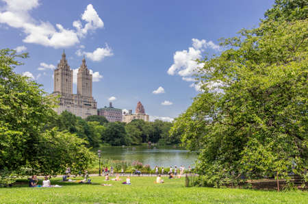 New York, NY - August 10, 2014 : A view of the lake and San Remo apartments from Central Park....