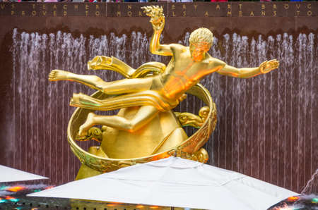 New York, NY - September 10, 2014 : A beautiful golden statue in Rockfeller plaza next to Top of The Rock in Manhattan, New York, USAのeditorial素材
