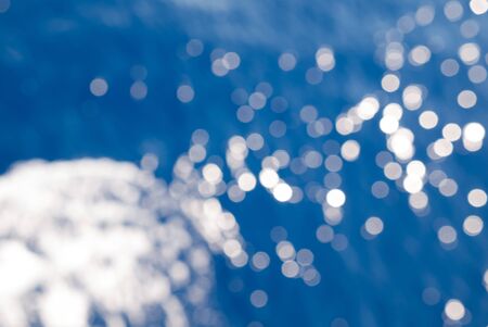 Bokeh effect on a seawater surface with wavesの写真素材