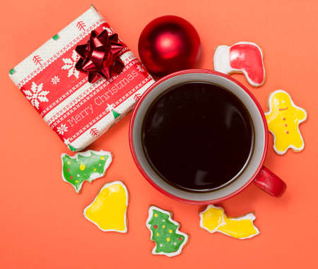 A cup of coffee and Christmas cookiesの写真素材