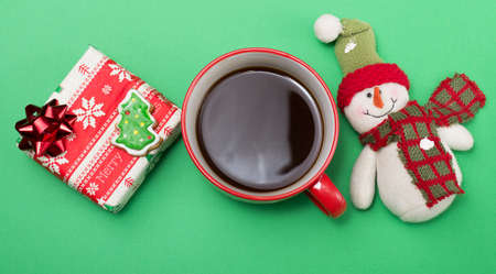 A cup of coffee, Christmas present and decorationの写真素材