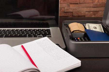 Steel cashbox with documents and moneyの写真素材