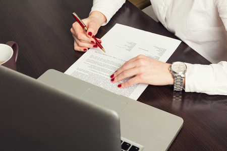 Working at the laptop in the office. Toned imageの写真素材