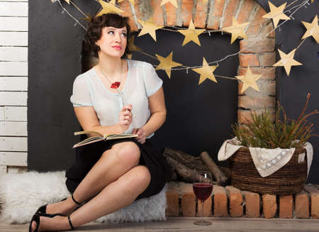 Woman enjoying a glass of red wineの写真素材