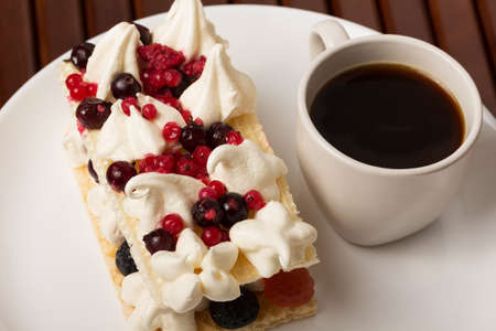 Berries and ice cream desert with coffee