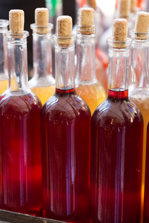 Bottles of home made wine at the street marketの写真素材