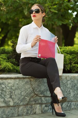 Stylish business woman in the city streetの写真素材