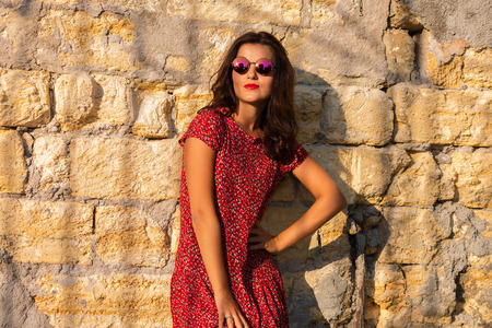 Pretty girl in the summer sunset lightの写真素材