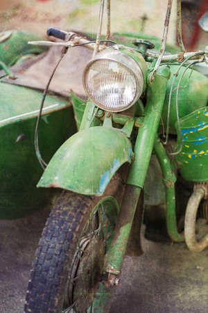 Green vintage motorbike headlamp. Retro textured imageの写真素材