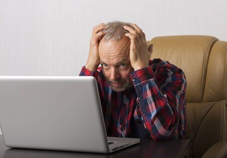 Man working at the laptop in the office