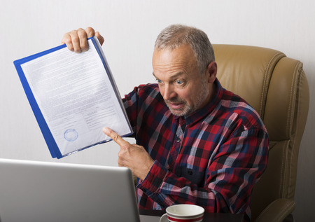 Man working at the laptop in the officeの写真素材