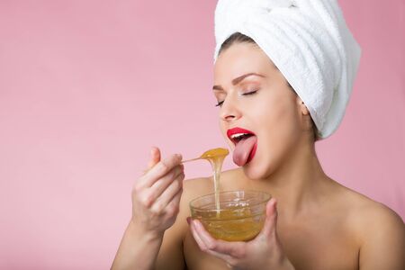 Woman holding sugar hair removing pasteの写真素材