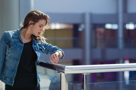 Pretty stylish woman walking in a shopping mallの写真素材
