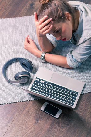 Beautiful woman with gadgetsの写真素材