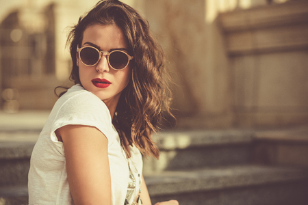 Stylish boho girl in summer cityの写真素材
