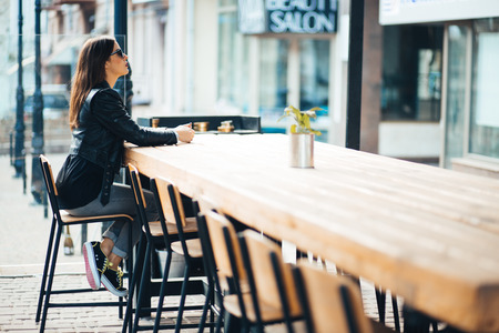 Stylish woman on a city street at summer dayの写真素材