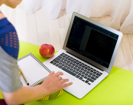 Woman sitting at the laptop
