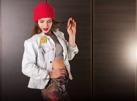 Young hipster woman in 90ties styled outfitの写真素材