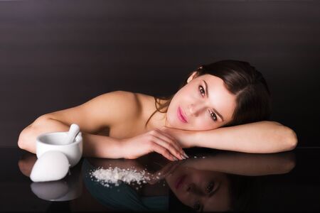 Pretty young woman with skin care productsの写真素材