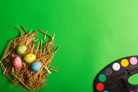 Colorful Easter eggs on a green backgroundの写真素材