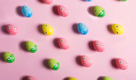 Colorful Easter eggs on a pink backgroundの写真素材
